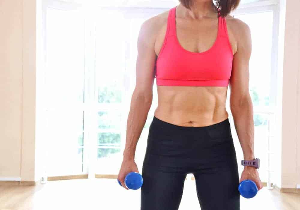 woman working out showing the missing key to weight loss she values strength
