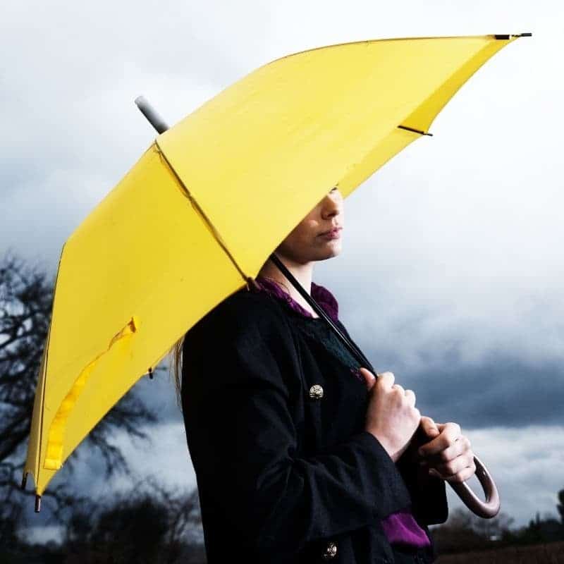 woman under umbrella for protection